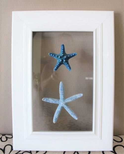An awesome real "Starfish" on a glass panel in a white frame. Stunning in all homes!!