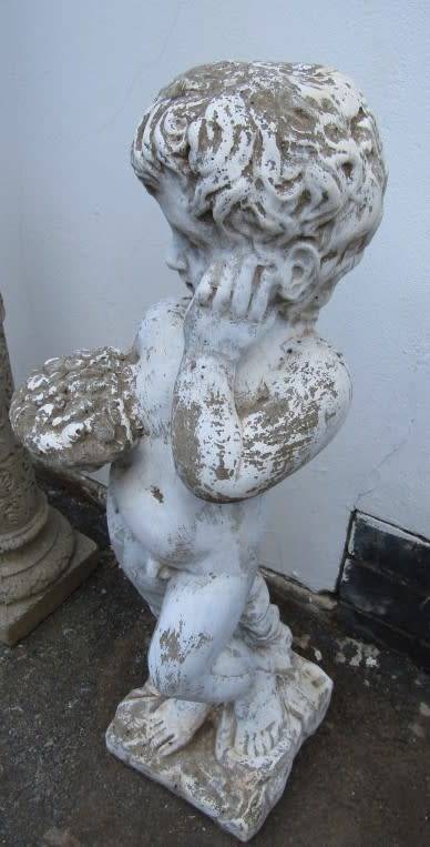 A gorgeous concrete statue of a little boy holding a bowl. Stunning in a garden! Linespace Sale