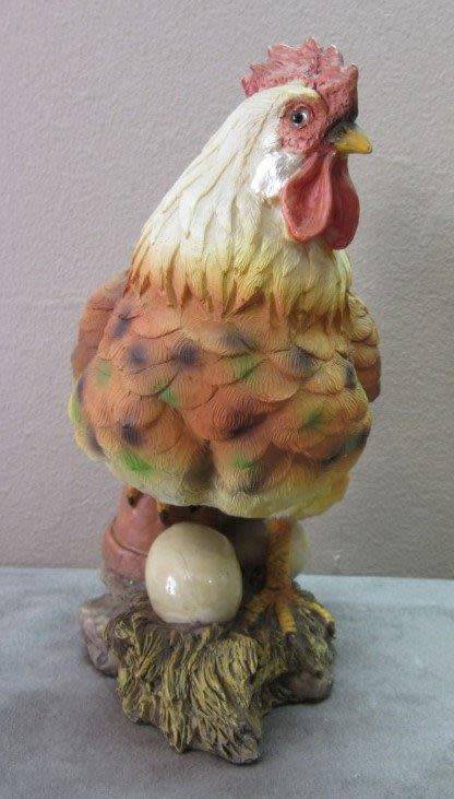A wonderful little plastic figurine of a hen surrounded by eggs, fabulous on display.