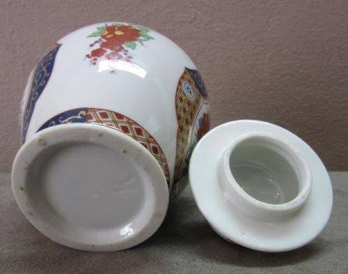A beautiful, colorful Chinese lidded Ginger jar . Gorgeous on display!!