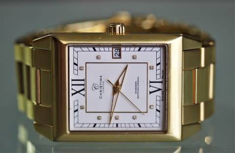 A good-looking original Christina London gold plated Swiss made diamond wrist watch.