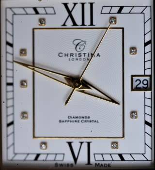 A good-looking original Christina London gold plated Swiss made diamond wrist watch.