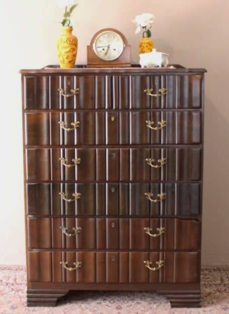 An exquisite vintage Imbuia 7-drawer chest of drawers with ornate handles and ample storage space.