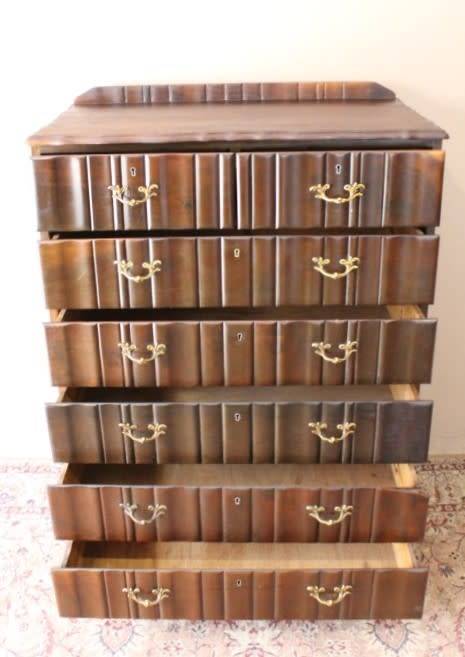 An exquisite vintage Imbuia 7-drawer chest of drawers with ornate handles and ample storage space.