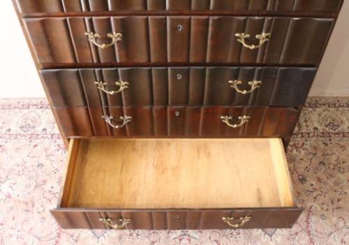 An exquisite vintage Imbuia 7-drawer chest of drawers with ornate handles and ample storage space.