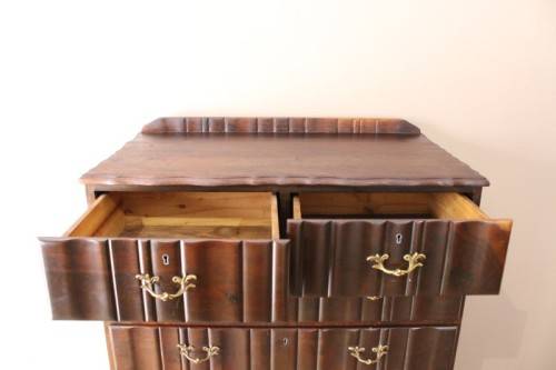 An exquisite vintage Imbuia 7-drawer chest of drawers with ornate handles and ample storage space.