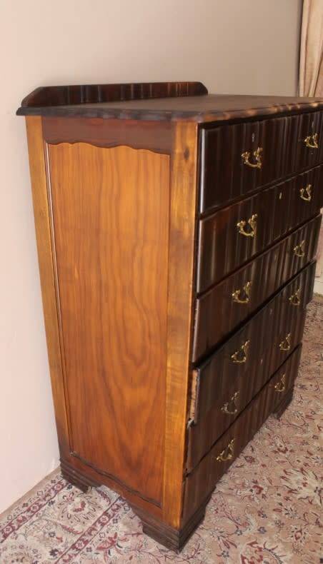 An exquisite vintage Imbuia 7-drawer chest of drawers with ornate handles and ample storage space.