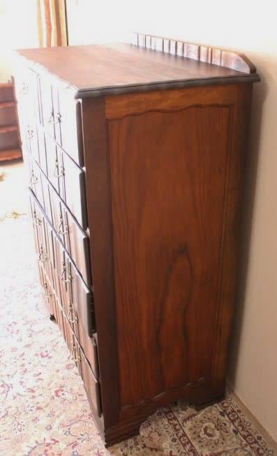 An exquisite vintage Imbuia 7-drawer chest of drawers with ornate handles and ample storage space.