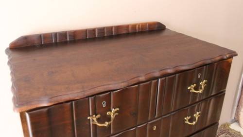 An exquisite vintage Imbuia 7-drawer chest of drawers with ornate handles and ample storage space.