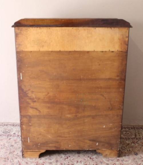 An exquisite vintage Imbuia 7-drawer chest of drawers with ornate handles and ample storage space.