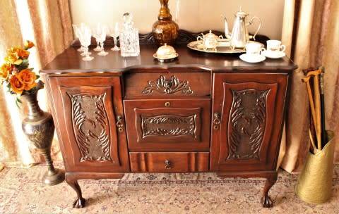 A gorgeous, large vintage Imbuia wood ball & claw buffet/ side server, with carved doors!