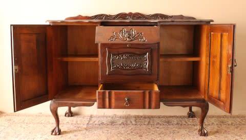 A gorgeous, large vintage Imbuia wood ball & claw buffet/ side server, with carved doors!