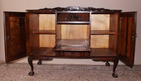 A gorgeous, large vintage Imbuia wood ball & claw buffet/ side server, with carved doors!