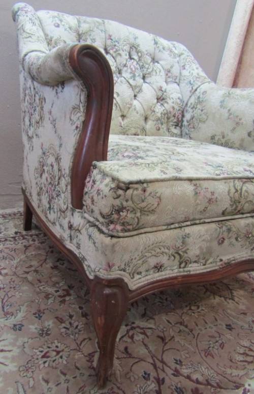 A gorgeous vintage Victorian styled arm chair w deep button, carved detailing & floral upholstery.