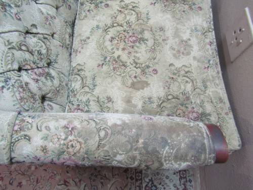 A gorgeous vintage Victorian styled arm chair w deep button, carved detailing & floral upholstery.