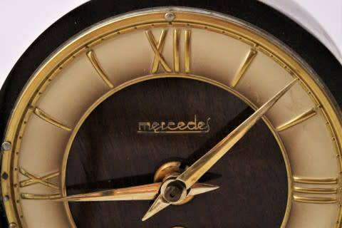 A beautiful wooden Mercedes mantel clock decorate with brass trimmings, working cold. Lifespace Sale
