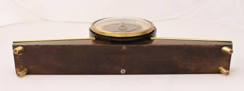 A beautiful wooden Mercedes mantel clock decorate with brass trimmings, working cold. Lifespace Sale