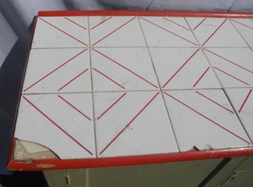A wonderful vintage tile top multi purpose cabinet. Great restoration project!