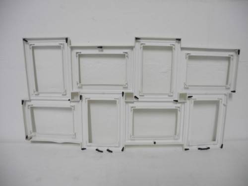A stunning white plastic wall mounted photo frame for 8 photos. Lifespace Sale