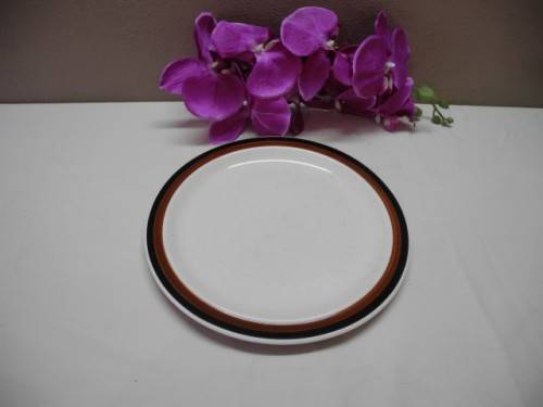 A colourful collection of various plates of different styles on a mixed table-Lifespace Sale