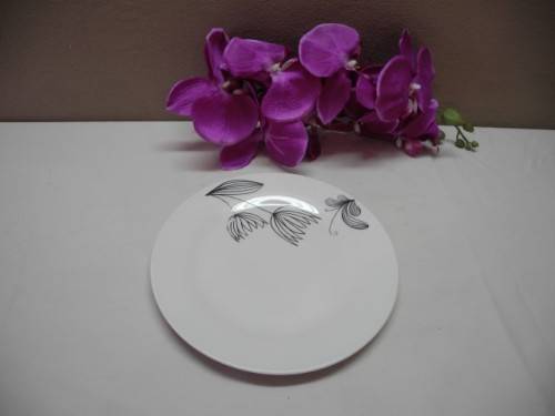 A colourful collection of various plates of different styles on a mixed table-Lifespace Sale