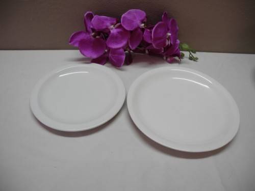 A colourful collection of various plates of different styles on a mixed table-Lifespace Sale