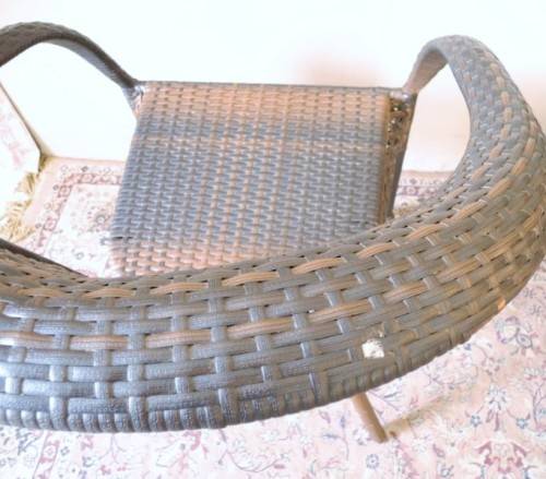 A fabulous four piece woven plastic outdoor patio set, three chairs and table.