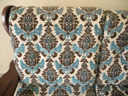 A colourful blue vintage Imbuia 2 seater couch - perfect in a lounge/patio/lapa.