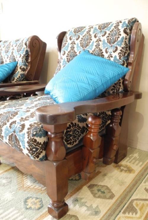 A pair of fabulous floral cushioned vintage Imbuia chairs - perfect in a lapa/patio.