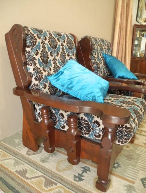 A pair of fabulous floral cushioned vintage Imbuia chairs - perfect in a lapa/patio.