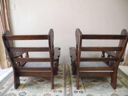 A pair of fabulous floral cushioned vintage Imbuia chairs - perfect in a lapa/patio.