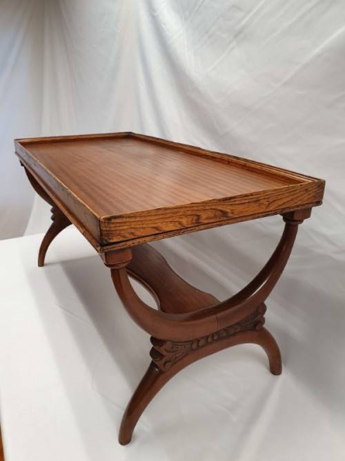 A carved Oak coffee table in good condition.Perfect in informal areas-Xmas Sale