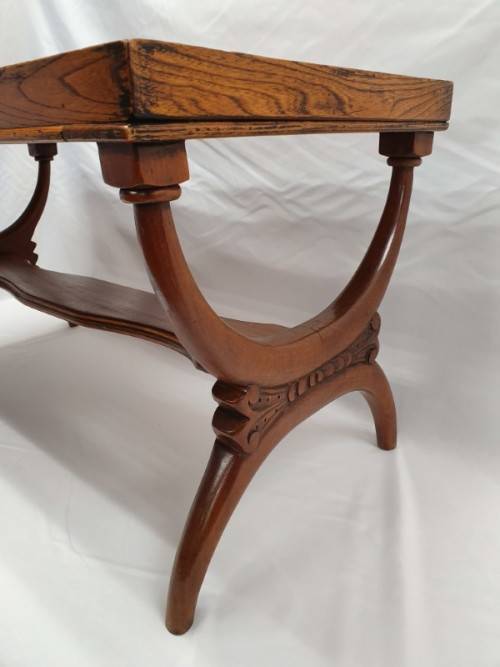 A carved Oak coffee table in good condition.Perfect in informal areas-Xmas Sale