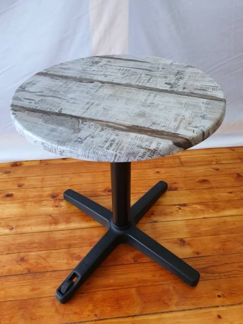 A lovely cafe style round table with newspaper print for indoor or outdoor use.-Xmas sale