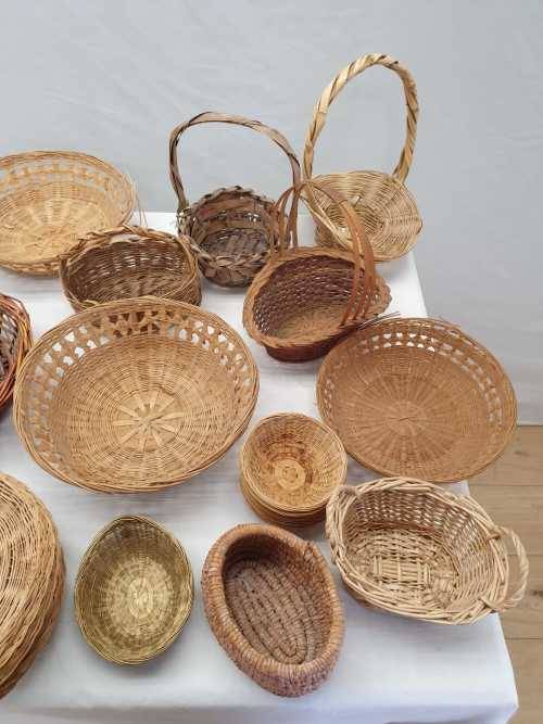 An assortment of table/ flower/ bread baskets, paper plate holders