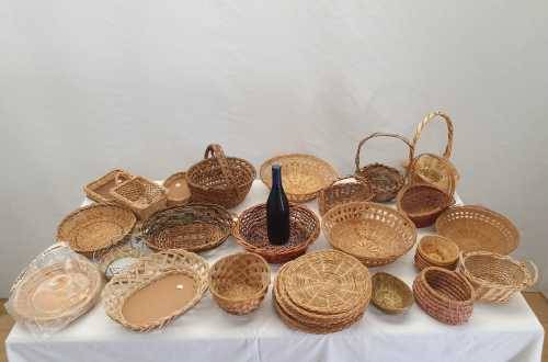 An assortment of table/ flower/ bread baskets, paper plate holders