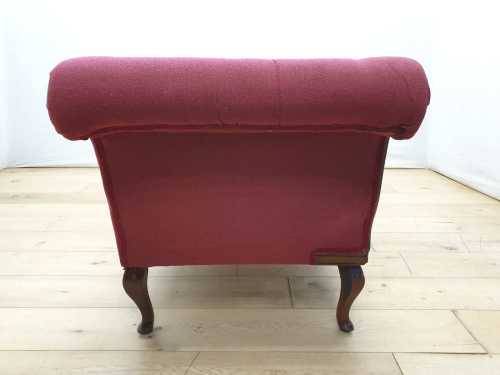 An Edwardian rail-back upholstered Chaise Lounge