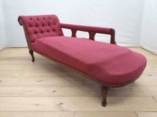 An Edwardian rail-back upholstered Chaise Lounge