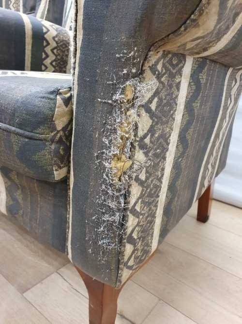 A pair of vintage Queen Anne footed Wingback upholstered arm chairs