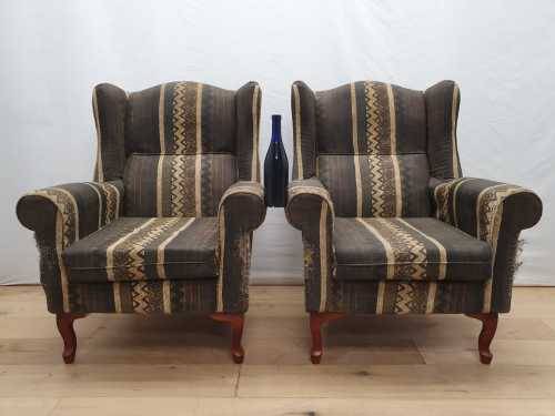 A pair of vintage Queen Anne footed Wingback upholstered arm chairs