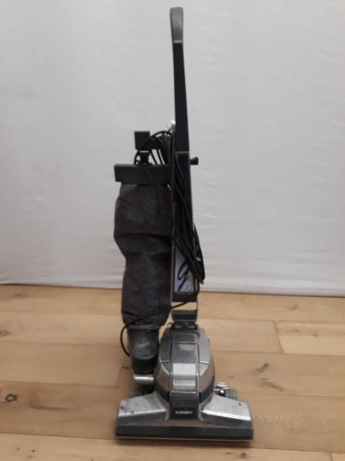 A Kirby vacuum cleaner in working order and a spare for parts (not working)