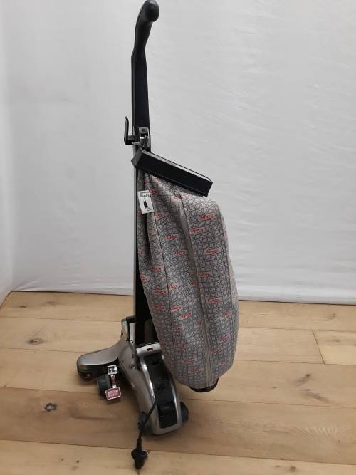 A Kirby vacuum cleaner in working order and a spare for parts (not working)