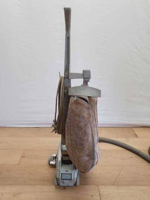 A Kirby vacuum cleaner in working order with extra attachments
