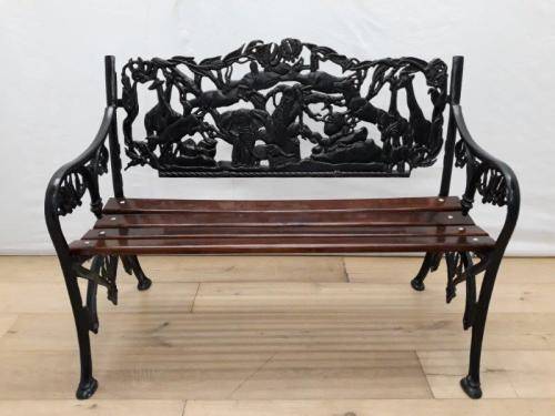 A cast iron slatted wood all weather garden/ patio bench.