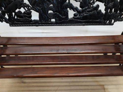 A cast iron slatted wood all weather garden/ patio bench.