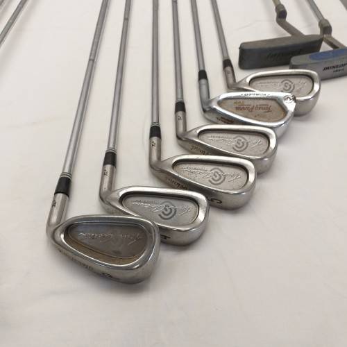 A collection of 11x assorted golf clubs, including irons, woods/ drivers and two putters