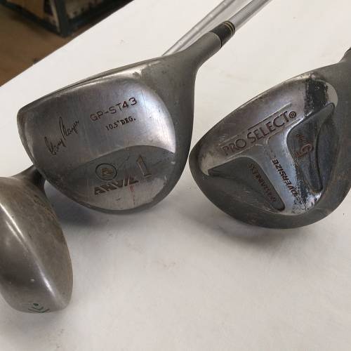 A collection of 11x assorted golf clubs, including irons, woods/ drivers and two putters