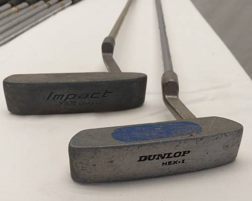 A collection of 11x assorted golf clubs, including irons, woods/ drivers and two putters