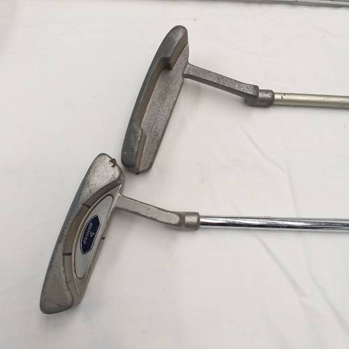 A collection of 11x assorted golf clubs, including irons, woods/ drivers and two putters