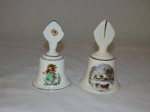 TWO STUNNING PORCELAIN HAND HELD BELLS WITH THEIR ORIGINAL PORCELAIN CLANGERS